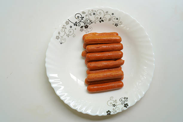 istock Delicious fired sausages on beautiful white plate. 2234289795