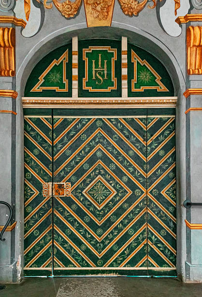 istock Beautiful ancient painted church door. Geometric and floral pattern 2234291059