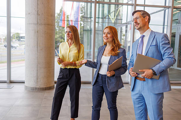 istock Business team walking and talking in modern office building lobby 2234291240