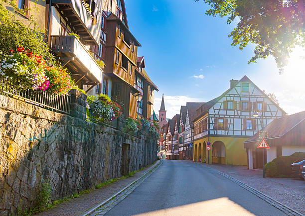 Traditional half timbered houses and church tower in Schiltach village Black Forest Germany historic town street
