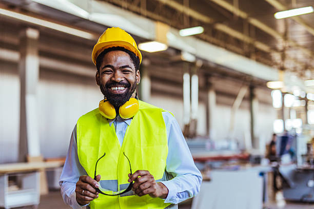 istock Smiling Construction Worker in Safety Gear Inside an Industrial Workshop 2234294366