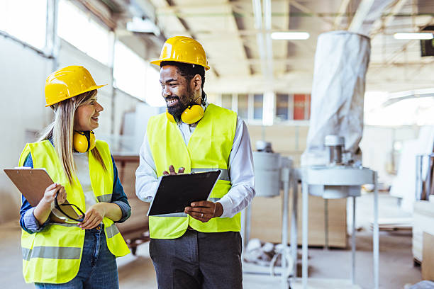 istock Industrial Workers Collaborating in a Modern Factory Setting 2234294619