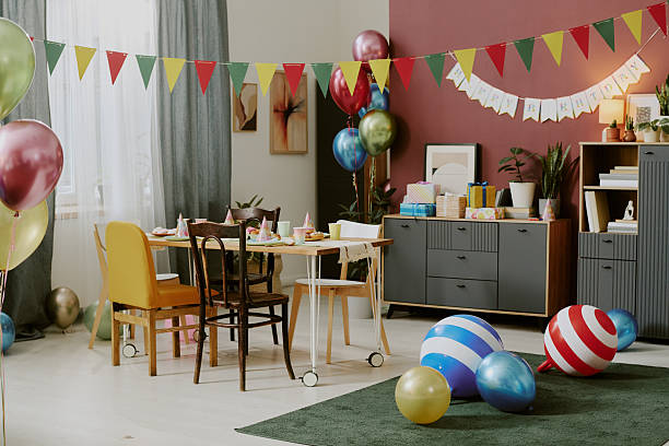 istock Empty Birthday Party Room Decorated with Balloons and Festive Table Setting 2234294725