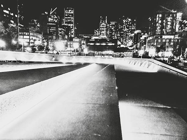 The Montreal skyline at night in black and white.