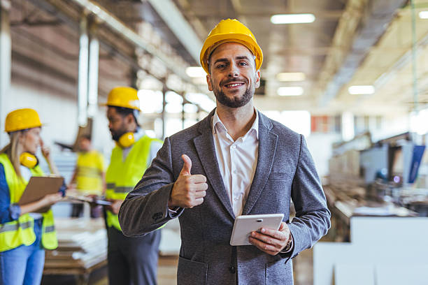 istock Confident Manager Overseeing Workplace Safety in a Busy Industrial Environment 2234298090