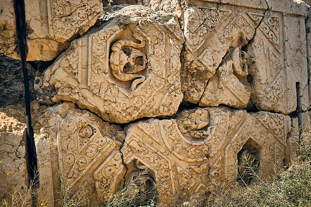 istock Ancient Carved Stone Wall with Ornamental Reliefs 2234298291