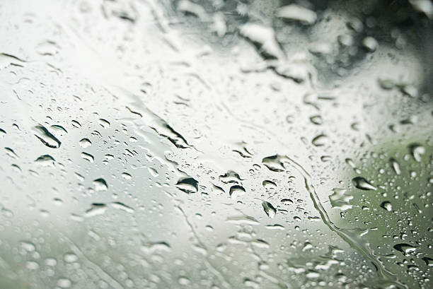 istock Water droplets on the windshield of a car 2234298625