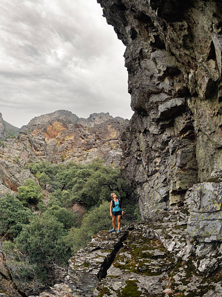 istock Looking in surprise at a large rock formation 2234300871