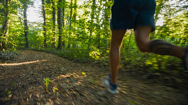 istock Athlete Running on a Trail in the Forest 2234304052