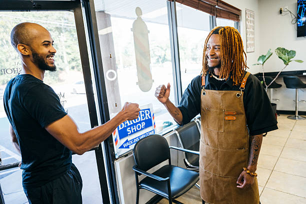 istock Barber greeting a returning client with a fist bump 2234305770