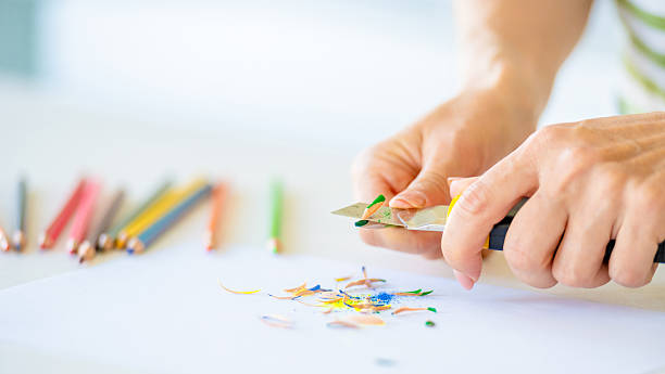 istock Woman Sharpening Colored Pencils 2234306164