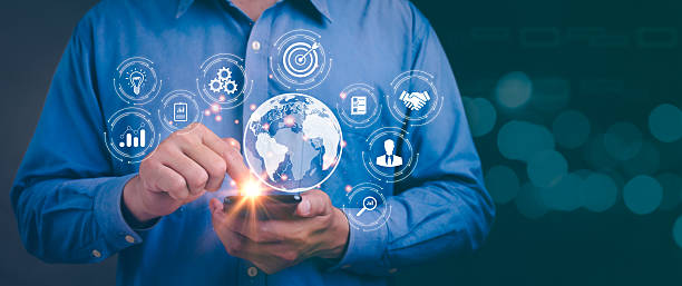 istock Dynamic businessman using smartphone for digital marketing applications connecting globally through technology and big data insights in financial banking environment 2234306706