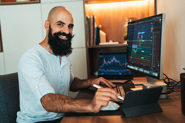 istock Trader investor analyst using multiple displays for cryptocurrency stock market, analyzing graph trading data index investment growth chart, plans strategy 2234309287