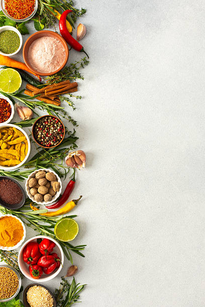istock Various cooking spices and herbs spread across a neutral gray background, showcasing their rich, natural tones, top view and copy space 2234309423