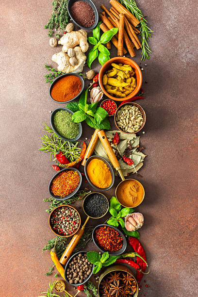 istock An artistic display of fragrant herbs and spices, scattered on a brown surface, blending natural hues and rich textures for a rustic culinary charm 2234309454