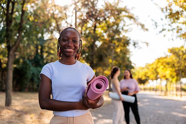 istock Young Black Woman with Exercise Mat 2234310949