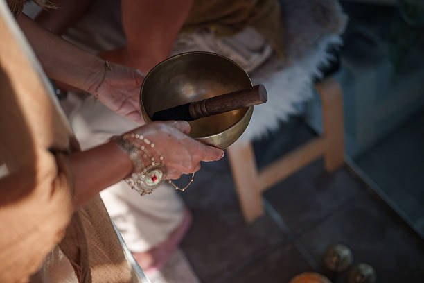 istock Therapist holding tibetan singing bowl during breathwork session 2234313334