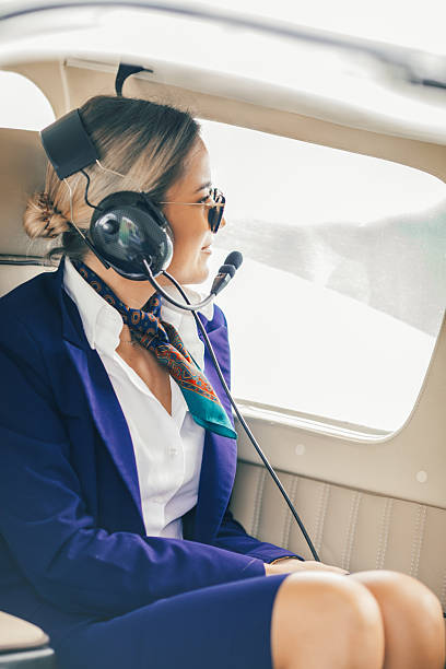 istock Stewardesses sitting in an airplane, getting ready for taking off 2234316399