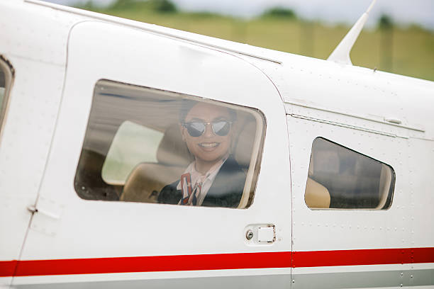 istock Stewardess sitting in an airplane, looking outside the window 2234316412