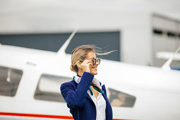 istock Stewardess in front of an airplane 2234316439
