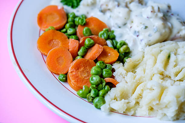 London UK, September 08 2025, Cod Fillet Fish With Mashed Potatoes Carrots And Peas In A Pasley Sauce