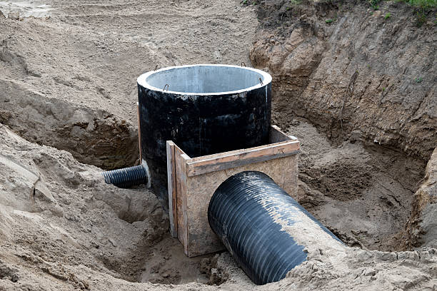 istock Construction site showing wastewater management system installation in a sandy trench 2234319204
