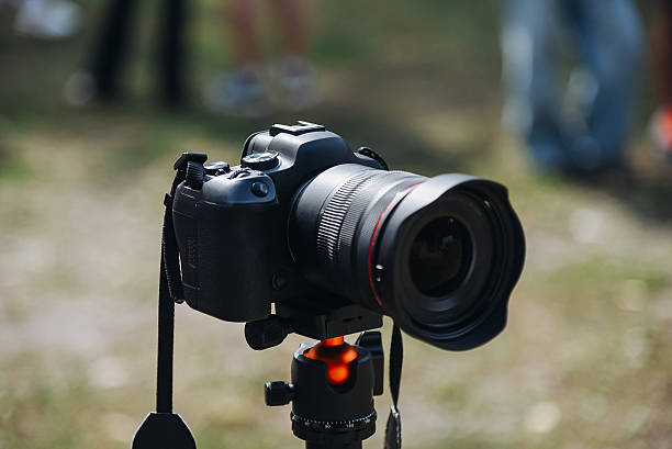 istock black dslr camera on tripod in city park in summer 2234319239