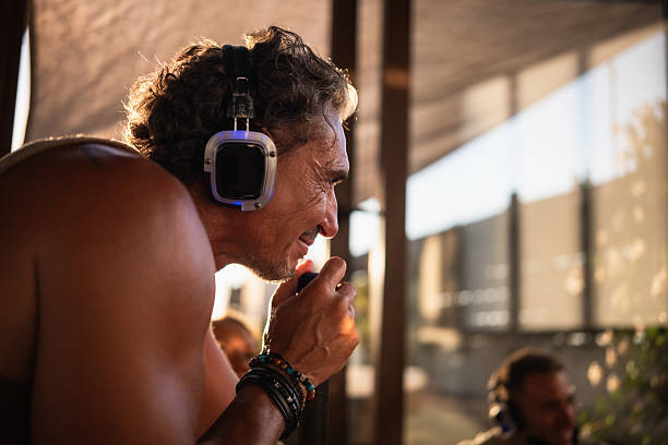 istock Mature man practicing breathwork with headphones during a guided meditation session 2234321249