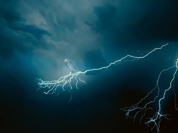 istock thunder lightning bolts illuminate the clouds in the background striking and intense atmosphere lighting spectacle blinds the brilliance of nature's elements 2234323263