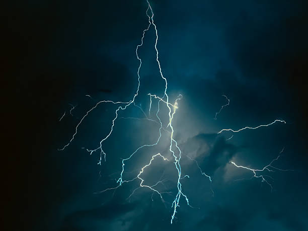 istock thunder lightning bolts illuminate the clouds in the background striking and intense atmosphere lighting spectacle blinds the brilliance of nature's elements 2234323288