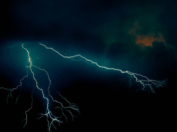 istock thunder lightning bolts illuminate the clouds in the background striking and intense atmosphere lighting spectacle blinds the brilliance of nature's elements 2234323290