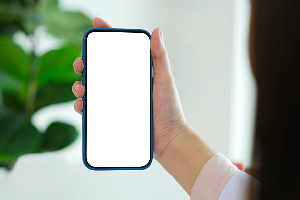 istock Female hand holding mobile phone with blank screen, Smartphone mockup isolated white screen, business and technology 2234323645