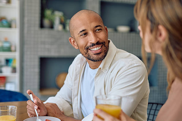 istock Happy couple enjoying breakfast together in modern kitchen 2234330976