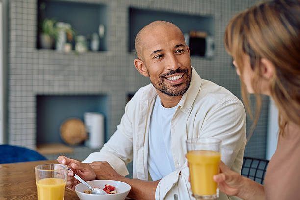 istock Happy couple enjoying breakfast together in modern kitchen 2234330997