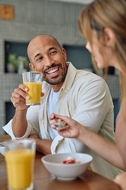 istock Happy couple enjoying breakfast together in modern kitchen 2234331123
