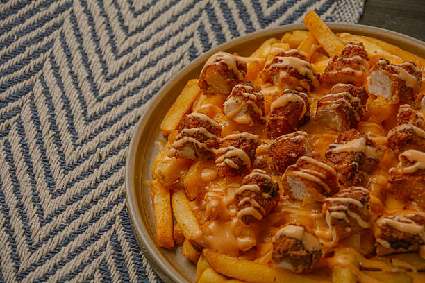 istock Appetizing Fast Food: Golden Chips and Spicy Wings - image-44 2234333347