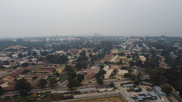 istock Cityscape with Dense Tree Cover and Buildings on a Hazy Day from an Elevated Position republic of congo 2234333352