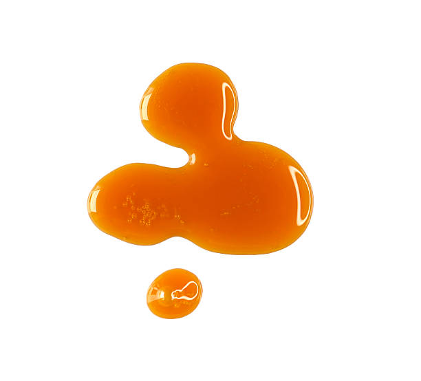 istock Drops of melted caramel, syrup isolated on white, clipping path, top view 2234335545