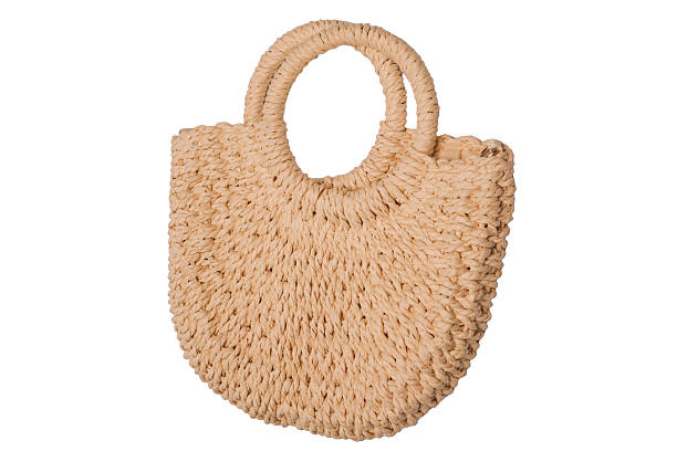 istock A beige straw bag isolated on a white background. 2234341102