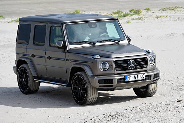 A Mercedes Benz AMG G-Class in Mojave Silver Metallic on the beach at Sankt Peter-Ording.