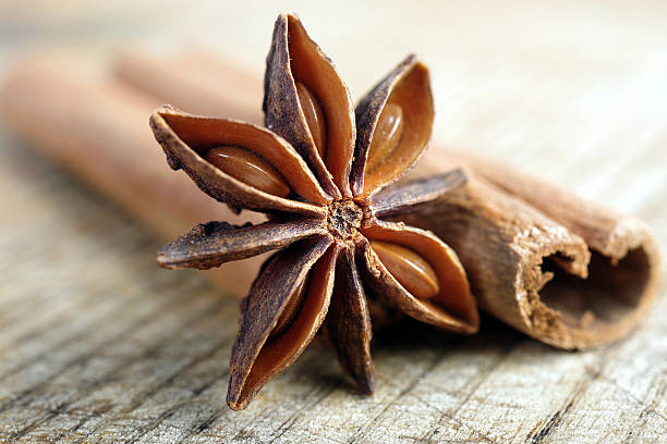 istock anise star and cinnamon on a wooden table close up 2234341614