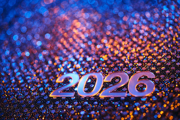 Modern metallic 2026 numbers on vibrant glitter background with festive bokeh