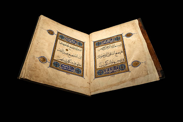 istock Illuminated Quran manuscript with ornate calligraphy and gold decorations 2234342639