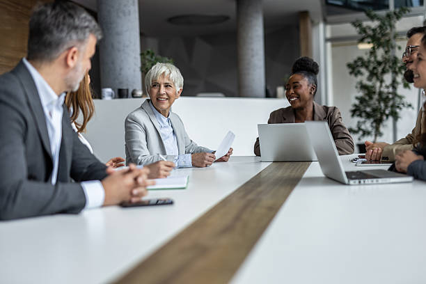 istock Business people collaborating during meeting in modern office 2234343800