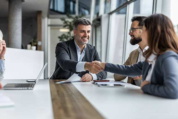 istock Business people shaking hands after successful meeting in office 2234343874