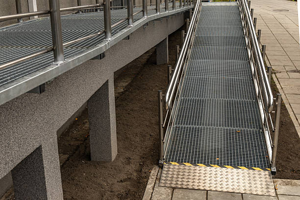 istock Accessible ramp for disabled people, metal ramp with handrails for strollers and disabled people, 2234346169