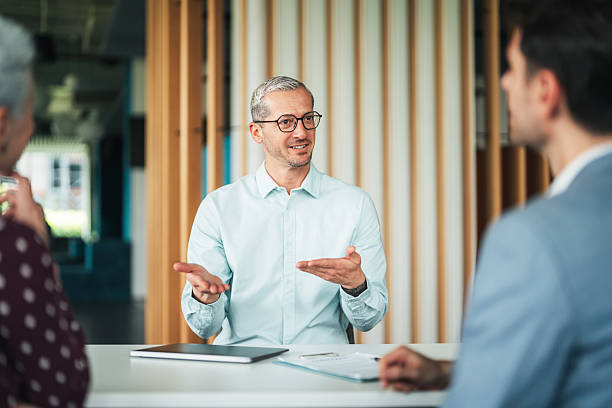 istock Business professional leading team meeting in modern office 2234346206