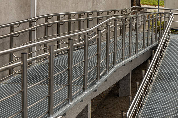 istock Accessible ramp for disabled people, metal ramp with handrails for strollers and disabled people, 2234346903