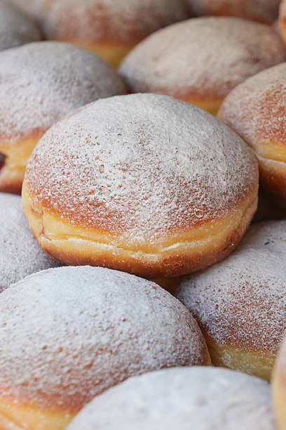 istock Sweet pastries dusted with powdered sugar on a market table 2234350238