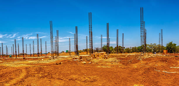 rebar work , pillar formwork, columns reinforced steel engineering construction site, african developments daytime, blue sky